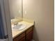 Clean bathroom with single sink vanity and mirrored medicine cabinet at 2570 Picardy N Cir # B, Atlanta, GA 30349