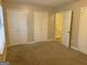 Bedroom with carpet, window, and double door closet at 2570 Picardy N Cir # B, Atlanta, GA 30349