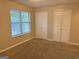 Bedroom with carpet, window and double door closets at 2570 Picardy N Cir # B, Atlanta, GA 30349