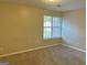 Bright bedroom with neutral walls and carpet at 2570 Picardy N Cir # B, Atlanta, GA 30349