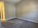 Spacious carpeted bedroom with neutral walls at 2570 Picardy N Cir # B, Atlanta, GA 30349