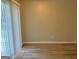 Simple dining area with sliding glass door and wood-look floors at 2570 Picardy N Cir # B, Atlanta, GA 30349