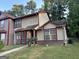 Two-story home with a red and beige exterior at 2570 Picardy N Cir # B, Atlanta, GA 30349