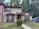 Two-story home with a red and beige exterior at 2570 Picardy N Cir # B, Atlanta, GA 30349