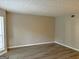 Spacious living room with laminate flooring and neutral walls at 2570 Picardy N Cir # B, Atlanta, GA 30349