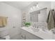 Modern bathroom vanity with white cabinets and quartz countertop at 166 Chappell Nw Rd, Atlanta, GA 30314