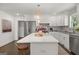 Modern kitchen with white cabinets, quartz countertops, and stainless steel appliances at 166 Chappell Nw Rd, Atlanta, GA 30314