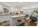 Open concept kitchen with island seating and a view into living area at 166 Chappell Nw Rd, Atlanta, GA 30314