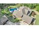 Overhead view of home, pool, and surrounding landscape at 140 Haddock Pt, Brooks, GA 30205