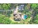 Aerial view of house, detached garage, and large lot with a circular driveway at 140 Haddock Pt, Brooks, GA 30205