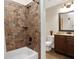 Updated bathroom features a shower/tub combo, granite vanity, and tile flooring at 140 Haddock Pt, Brooks, GA 30205