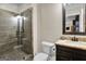 Basement bathroom with granite vanity, large shower, and frameless glass enclosure at 140 Haddock Pt, Brooks, GA 30205