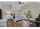 Bright bedroom with a window seat, hardwood floors, and built-in workspace at 140 Haddock Pt, Brooks, GA 30205