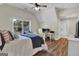 Spacious bedroom with hardwood floors, large window, and en-suite bathroom access at 140 Haddock Pt, Brooks, GA 30205
