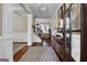 Bright entryway with hardwood floors, a console table, and view to living room at 140 Haddock Pt, Brooks, GA 30205