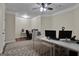 Spacious home office with two desks, hardwood floors, and a ceiling fan at 140 Haddock Pt, Brooks, GA 30205