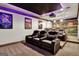 Home theater with reclining seats and a large projection screen at 140 Haddock Pt, Brooks, GA 30205