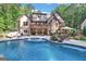 Stunning home with large pool, spacious patio, and outdoor kitchen at 140 Haddock Pt, Brooks, GA 30205