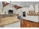 Spacious kitchen featuring granite countertops, stainless steel appliances, and hardwood floors at 140 Haddock Pt, Brooks, GA 30205