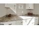 Bright laundry room with ample counter space and cabinets at 140 Haddock Pt, Brooks, GA 30205