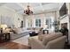 Spacious living room boasts a cozy sectional sofa and fireplace at 140 Haddock Pt, Brooks, GA 30205
