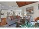 Open living room with hardwood floors and a view into the kitchen at 140 Haddock Pt, Brooks, GA 30205