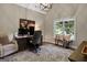 Home office with built-in desk and hardwood floors at 140 Haddock Pt, Brooks, GA 30205