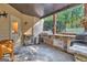 Covered patio features an outdoor kitchen with built-in grill and stone countertops at 140 Haddock Pt, Brooks, GA 30205