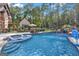 Resort-style pool with waterfall feature and swim-up seating at 140 Haddock Pt, Brooks, GA 30205