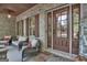 Porch with comfortable seating and fall decor at 140 Haddock Pt, Brooks, GA 30205