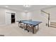 Finished basement with a ping pong table and extra storage space at 123 Red Maple Dr, Peachtree City, GA 30269