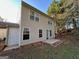 The backyard is a grassy area with a patio at 516 Jaclyn Cir, Mcdonough, GA 30253