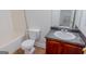 Cozy bathroom features a vanity with a gray countertop and a toilet at 516 Jaclyn Cir, Mcdonough, GA 30253