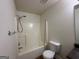 Bathroom features a shower and tub combination, sink, and toilet at 516 Jaclyn Cir, Mcdonough, GA 30253