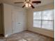 Bedroom featuring carpeted floors, a ceiling fan, and a window for natural light at 516 Jaclyn Cir, Mcdonough, GA 30253