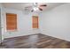 Bedroom featuring hardwood floors, ceiling fan and window with wood blinds at 516 Jaclyn Cir, Mcdonough, GA 30253