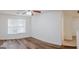 Bedroom features hardwood flooring, a ceiling fan, and a double door closet at 516 Jaclyn Cir, Mcdonough, GA 30253
