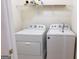 Washer and dryer hookups with shelving above for ample storage space at 516 Jaclyn Cir, Mcdonough, GA 30253