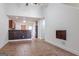 Open concept living area featuring tile flooring, bar seating, and seamless flow to kitchen at 516 Jaclyn Cir, Mcdonough, GA 30253