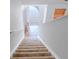 Carpeted staircase leading to a living area, lit by natural light from a window at 516 Jaclyn Cir, Mcdonough, GA 30253