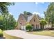 Brick house with a three-car garage and a long driveway at 185 Fieldstone Way, Fayetteville, GA 30215