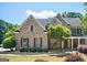 Brick two-story house with a large front yard and porch at 185 Fieldstone Way, Fayetteville, GA 30215