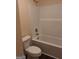 Bathroom features a bathtub and shower combination, alongside a standard toilet at 200 Parker Dr, Mcdonough, GA 30253