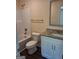 Standard bathroom featuring a white vanity, toilet, and combined tub and shower with neutral decor at 200 Parker Dr, Mcdonough, GA 30253