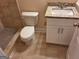 This bathroom includes a toilet, a vanity with granite countertop, and a tiled shower at 200 Parker Dr, Mcdonough, GA 30253
