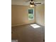 A bedroom features carpeting, a window and a ceiling fan at 200 Parker Dr, Mcdonough, GA 30253
