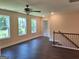 Bonus room with natural lighting, wood floors, and view of the outdoors through large windows at 200 Parker Dr, Mcdonough, GA 30253