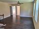 Well-lit bonus room with dark floors showcasing open doorway and inviting natural light from the windows at 200 Parker Dr, Mcdonough, GA 30253
