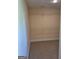 A walk-in closet features wire shelving, providing ample storage in a neutral-toned space at 200 Parker Dr, Mcdonough, GA 30253