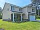 Two-story home with brick and siding and a well-manicured lawn under a clear blue sky at 200 Parker Dr, Mcdonough, GA 30253